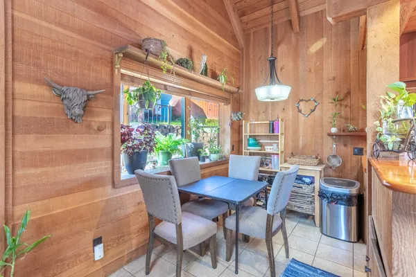 a dining room with furniture and window