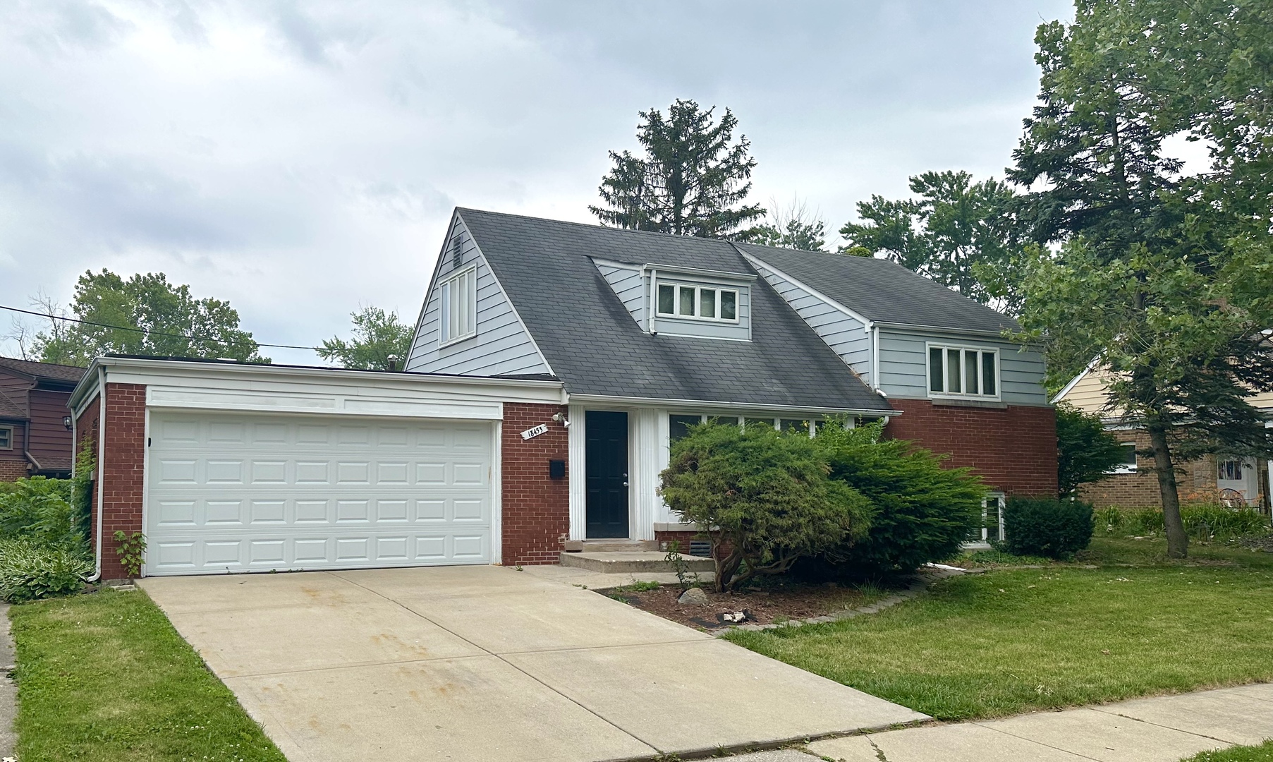 18453 Clyde Road Homewood, IL 60430 - Photo 2 of 15 a front view of a house with garden