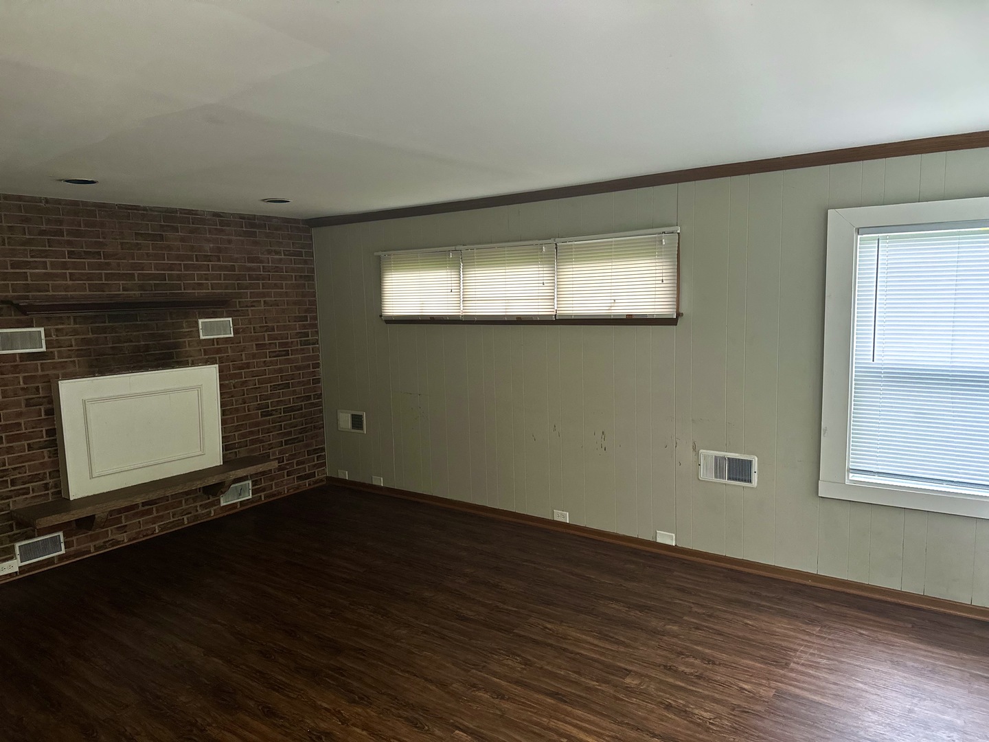 18453 Clyde Road Homewood, IL 60430 - Photo 6 of 15 an empty room with wooden floor and windows