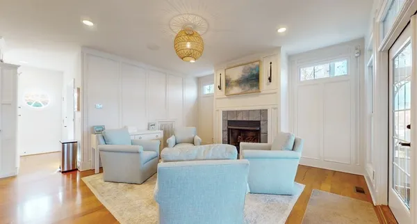 a view of a dining room with furniture window and wooden floor