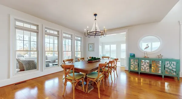 a kitchen with stainless steel appliances granite countertop a sink stove refrigerator and cabinets
