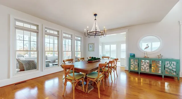 a kitchen with stainless steel appliances granite countertop a sink stove refrigerator and cabinets