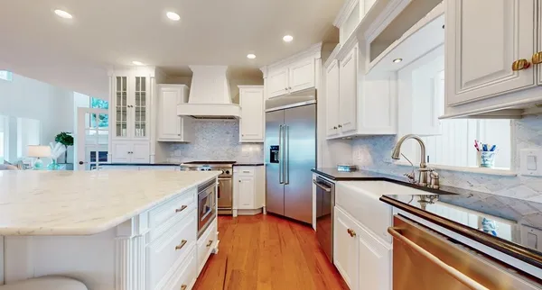 a spacious bathroom with a tub shower and mirror