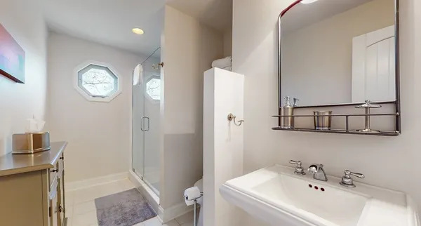 a living room with furniture a fireplace and a floor to ceiling window
