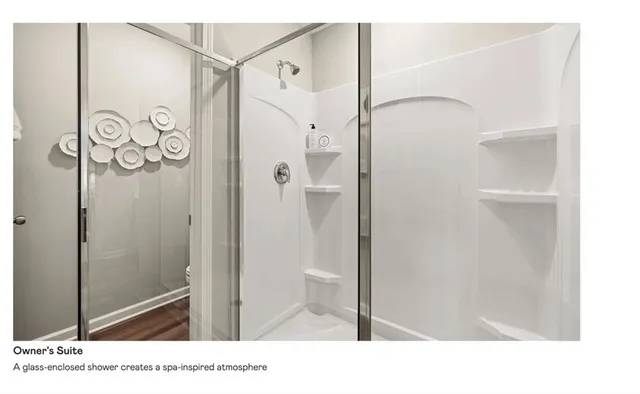 a bathroom with a shower and a sink