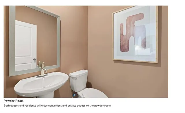 a bathroom with a sink mirror and vanity