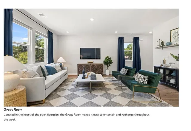 a living room with furniture a rug and a flat screen tv
