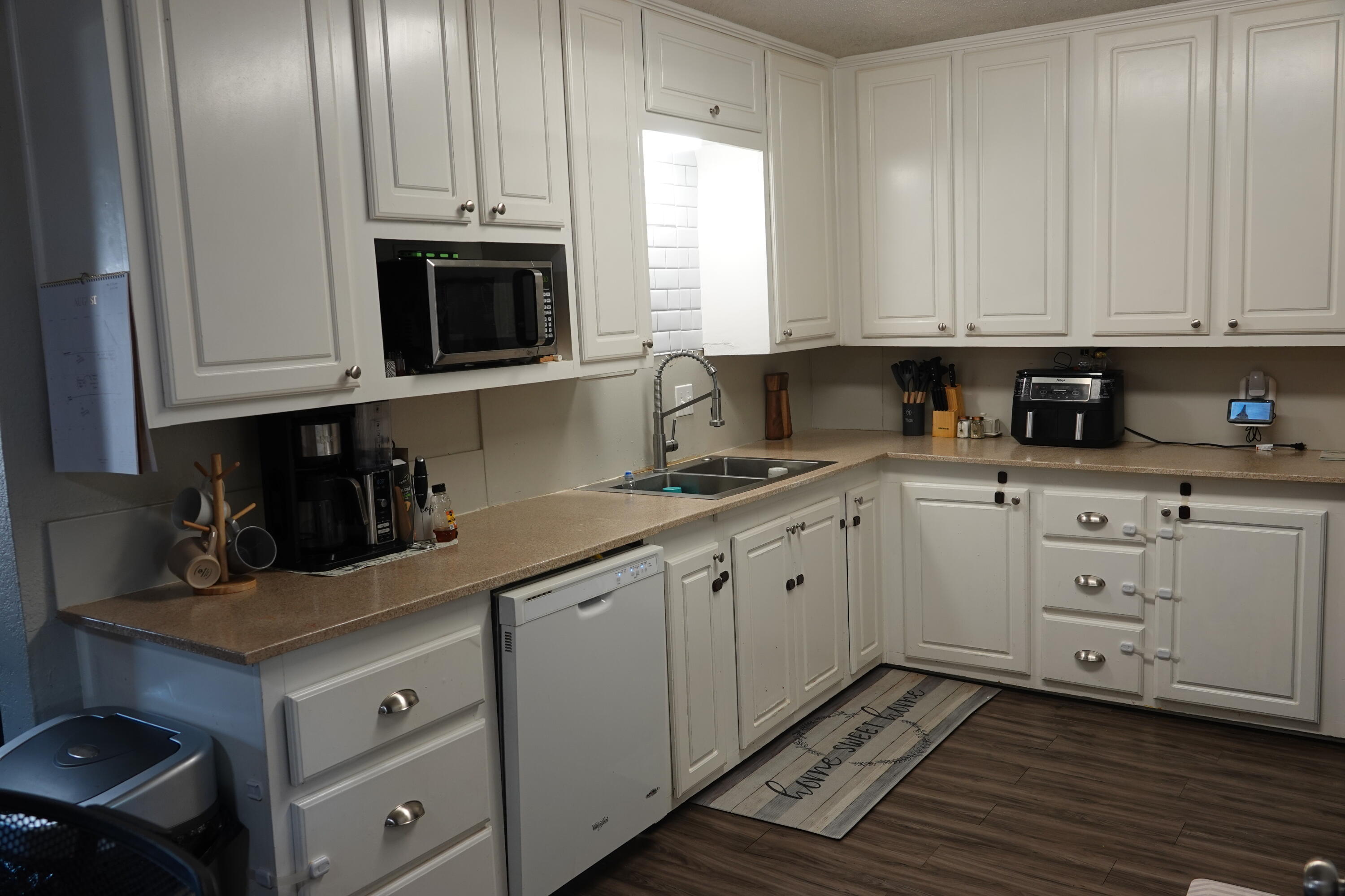 5310 24th Street Lubbock, TX 79407 - Photo 13 of 34 a kitchen with granite countertop white cabinets and stainless steel appliances