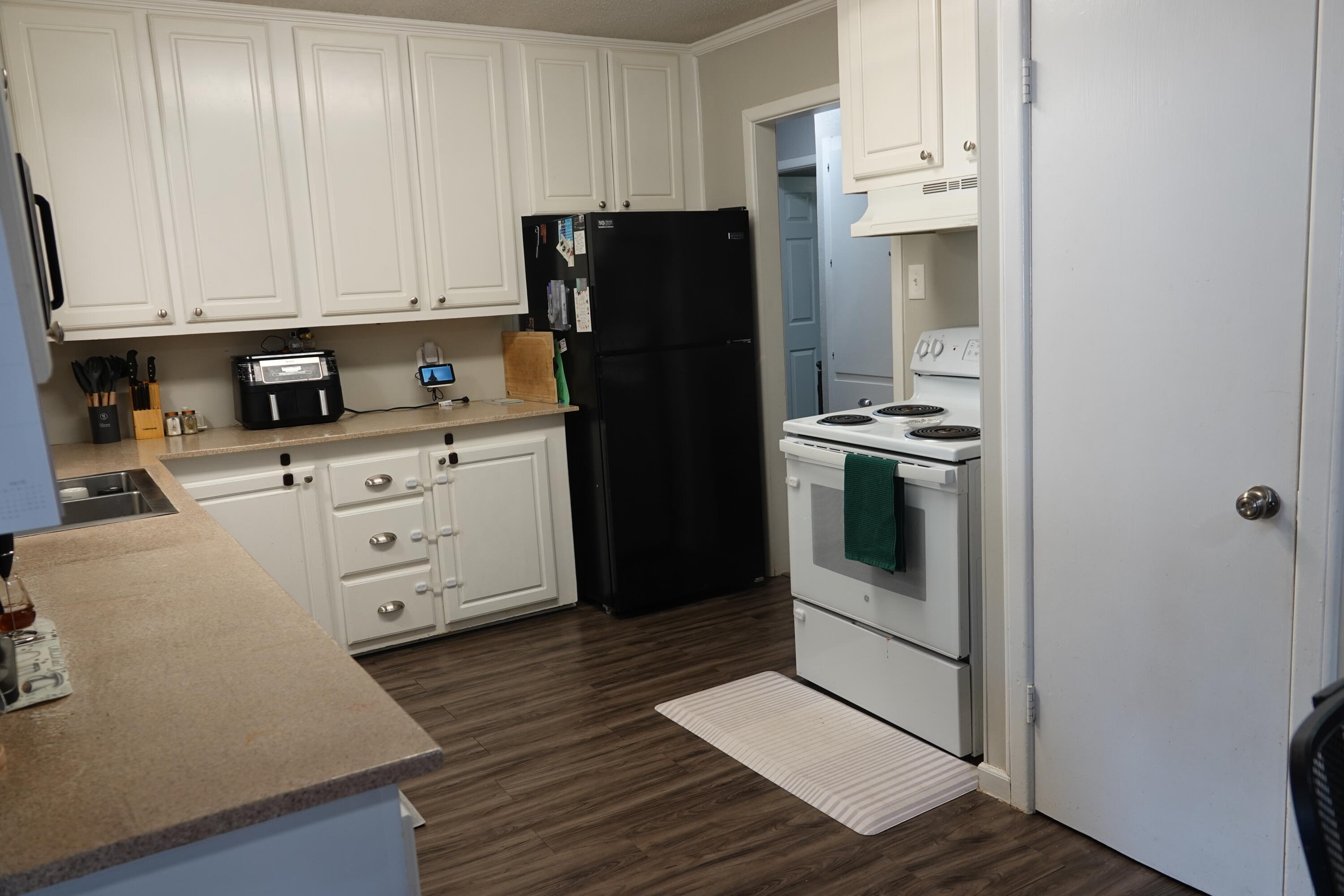 5310 24th Street Lubbock, TX 79407 - Photo 14 of 34 a kitchen with stainless steel appliances a refrigerator stove and cabinets