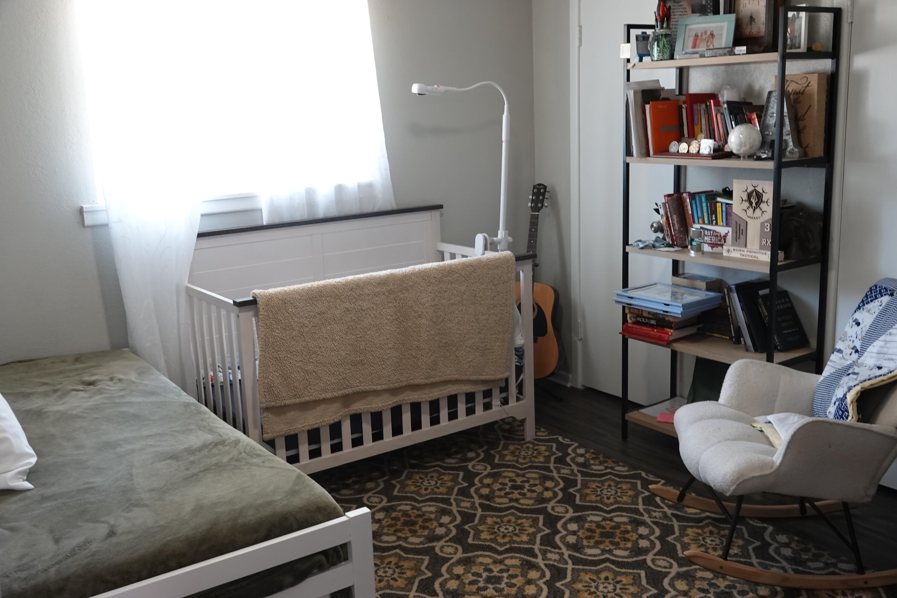5310 24th Street Lubbock, TX 79407 - Photo 27 of 34 a living room with furniture and a book shelf