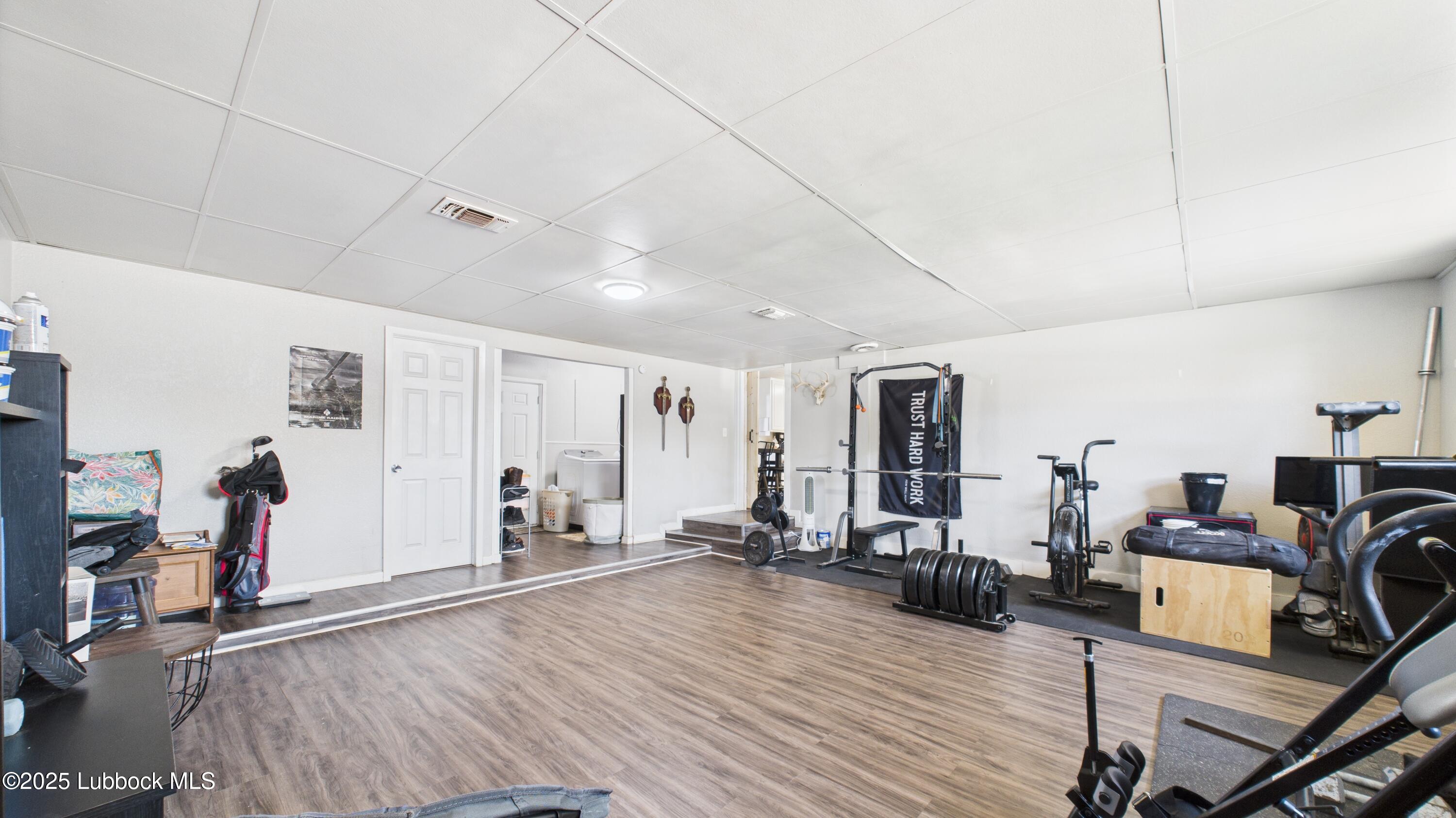 5310 24th Street Lubbock, TX 79407 - Photo 30 of 34 a view of a livingroom with furniture and a flat screen tv
