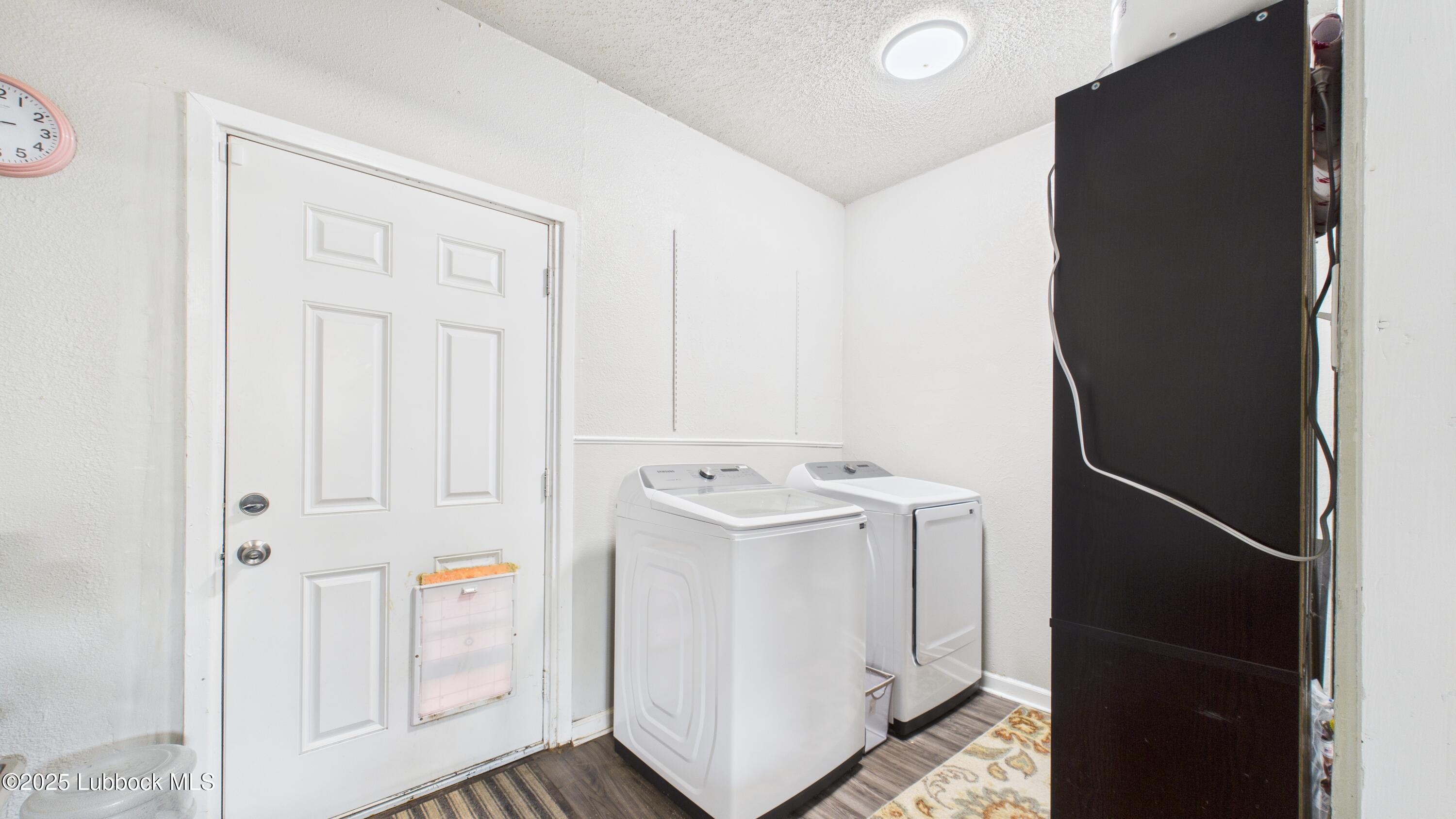 5310 24th Street Lubbock, TX 79407 - Photo 31 of 34 a utility room with dryer and washer