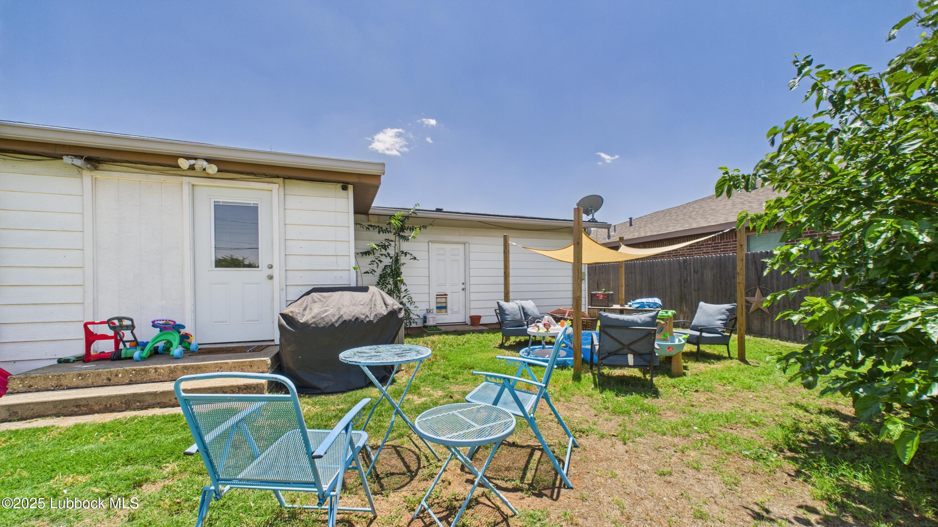 5310 24th Street Lubbock, TX 79407 - Photo 33 of 34 a backyard of a house with table and chairs