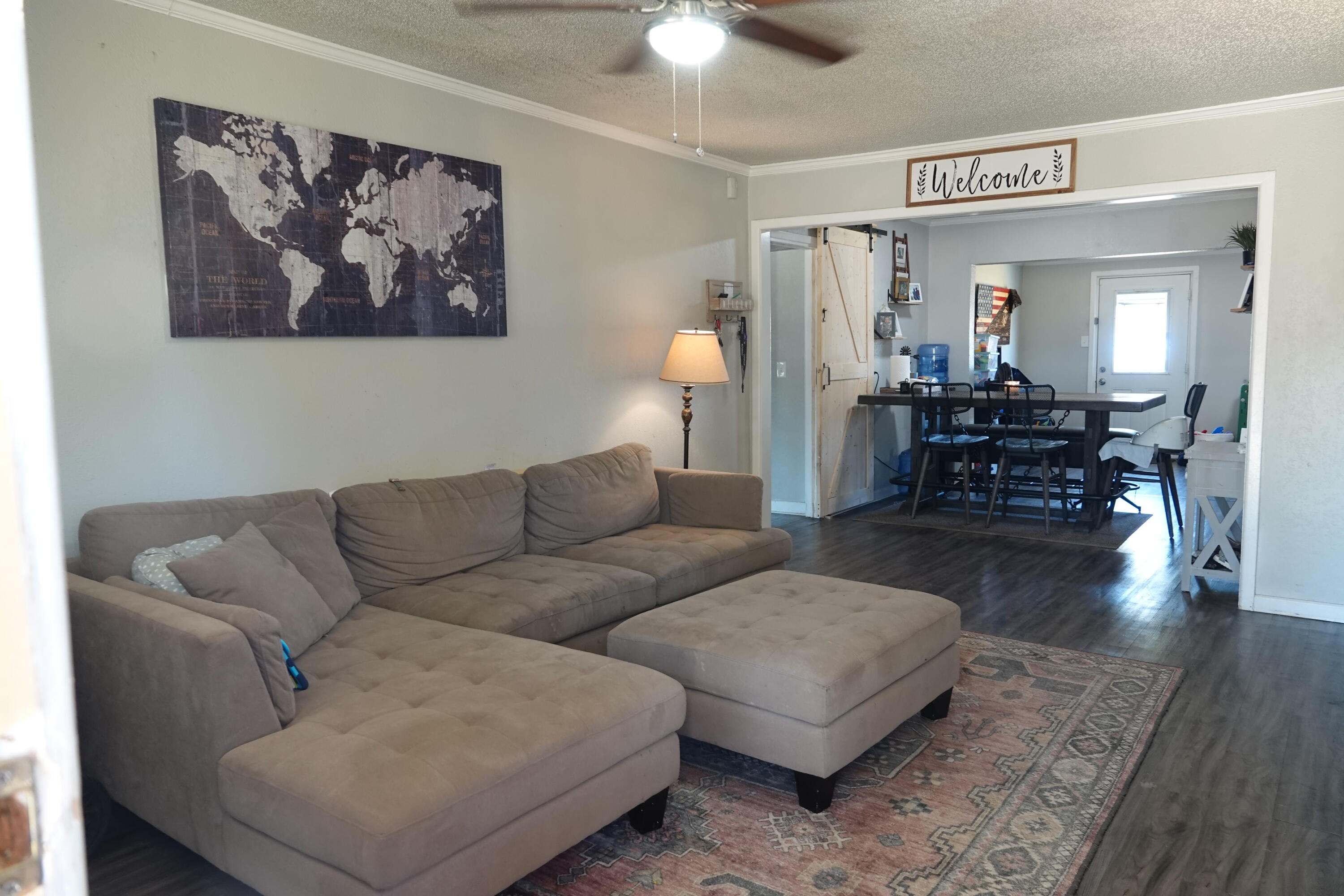 5310 24th Street Lubbock, TX 79407 - Photo 5 of 34 a living room with furniture and wooden floor