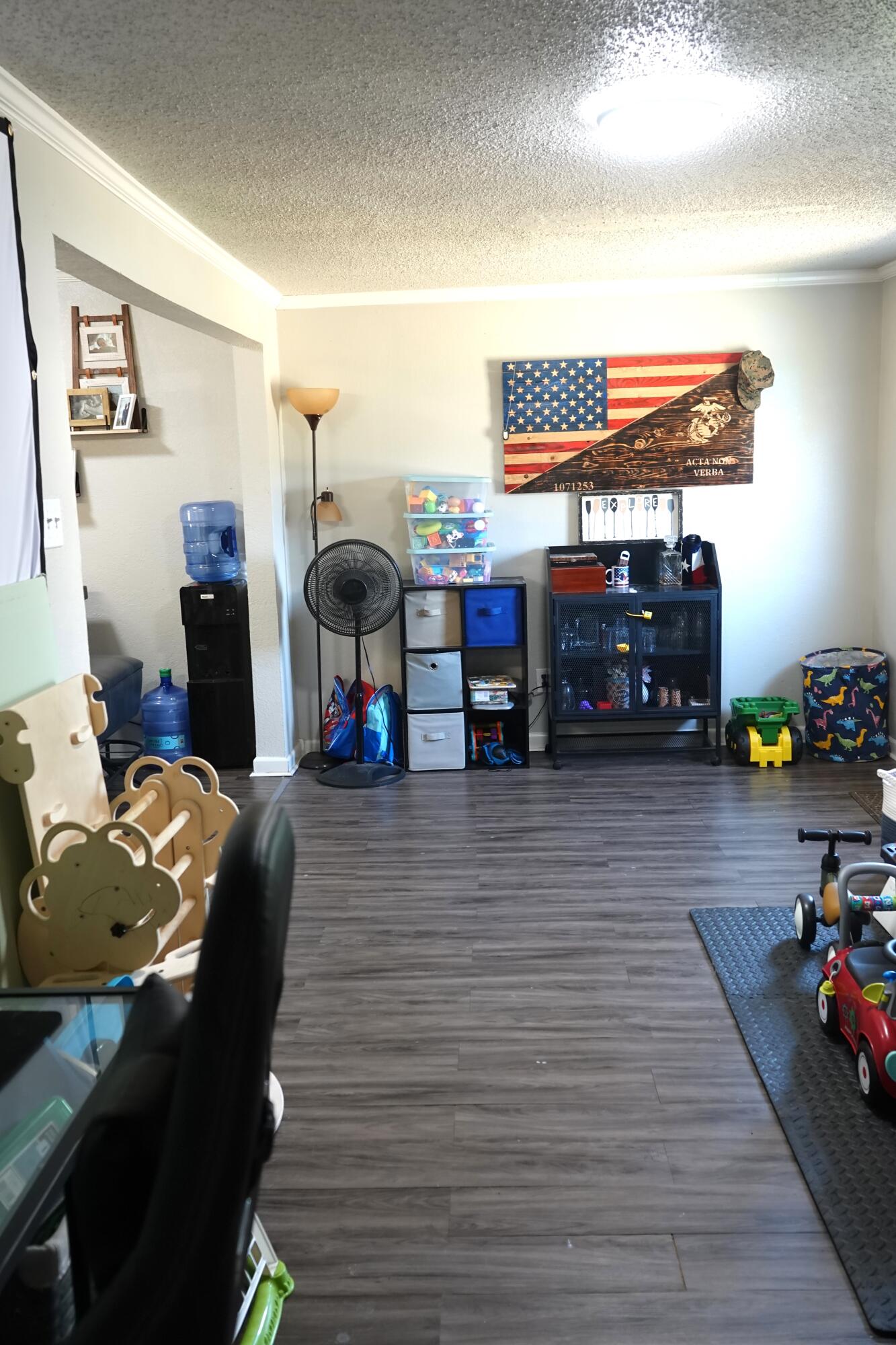 5310 24th Street Lubbock, TX 79407 - Photo 9 of 34 a living room with furniture and a flat screen tv