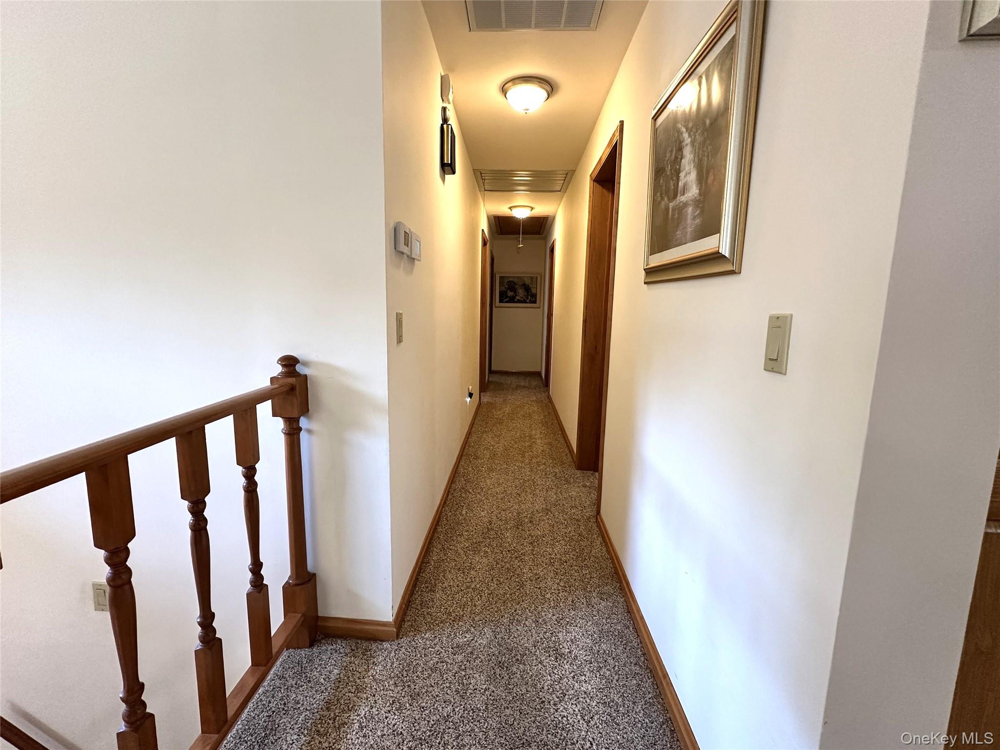 60 Manchester Road Rock Hill, NY 12775 - Photo 14 of 47 a view of a hallway with wooden floor and staircase