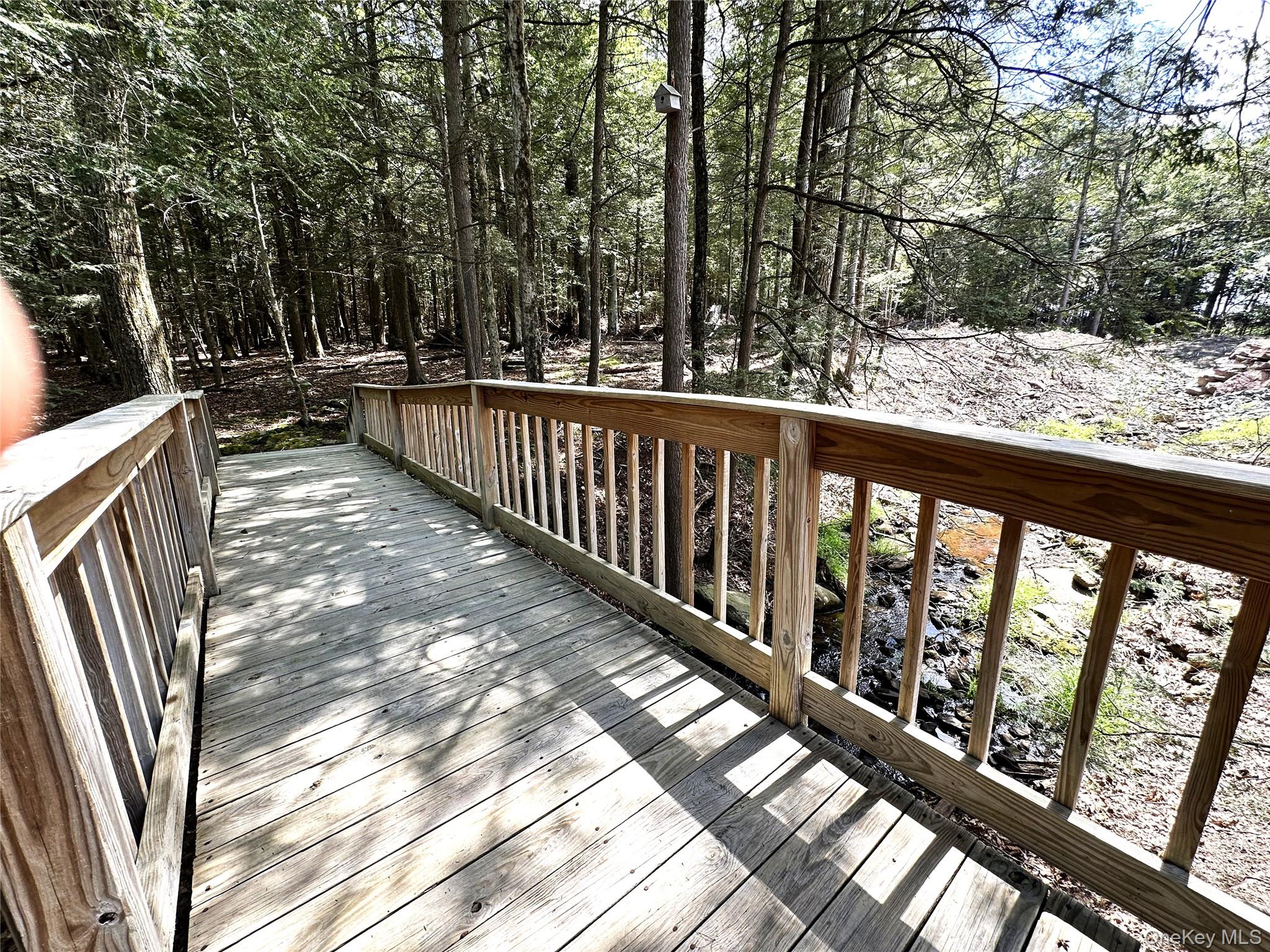 60 Manchester Road Rock Hill, NY 12775 - Photo 37 of 47 a view of balcony with wooden floor and fence