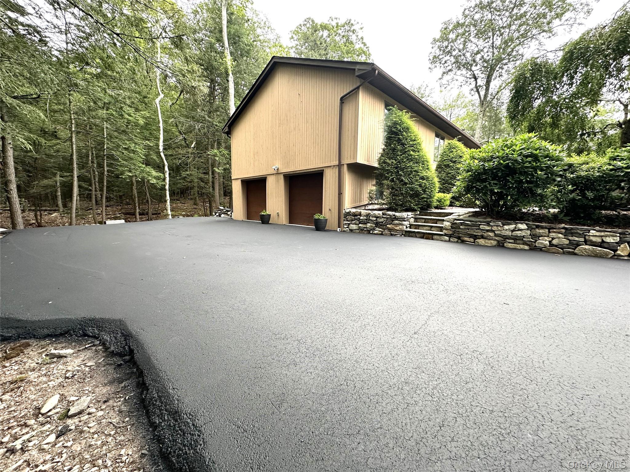 60 Manchester Road Rock Hill, NY 12775 - Photo 38 of 47 a view of a house with a patio