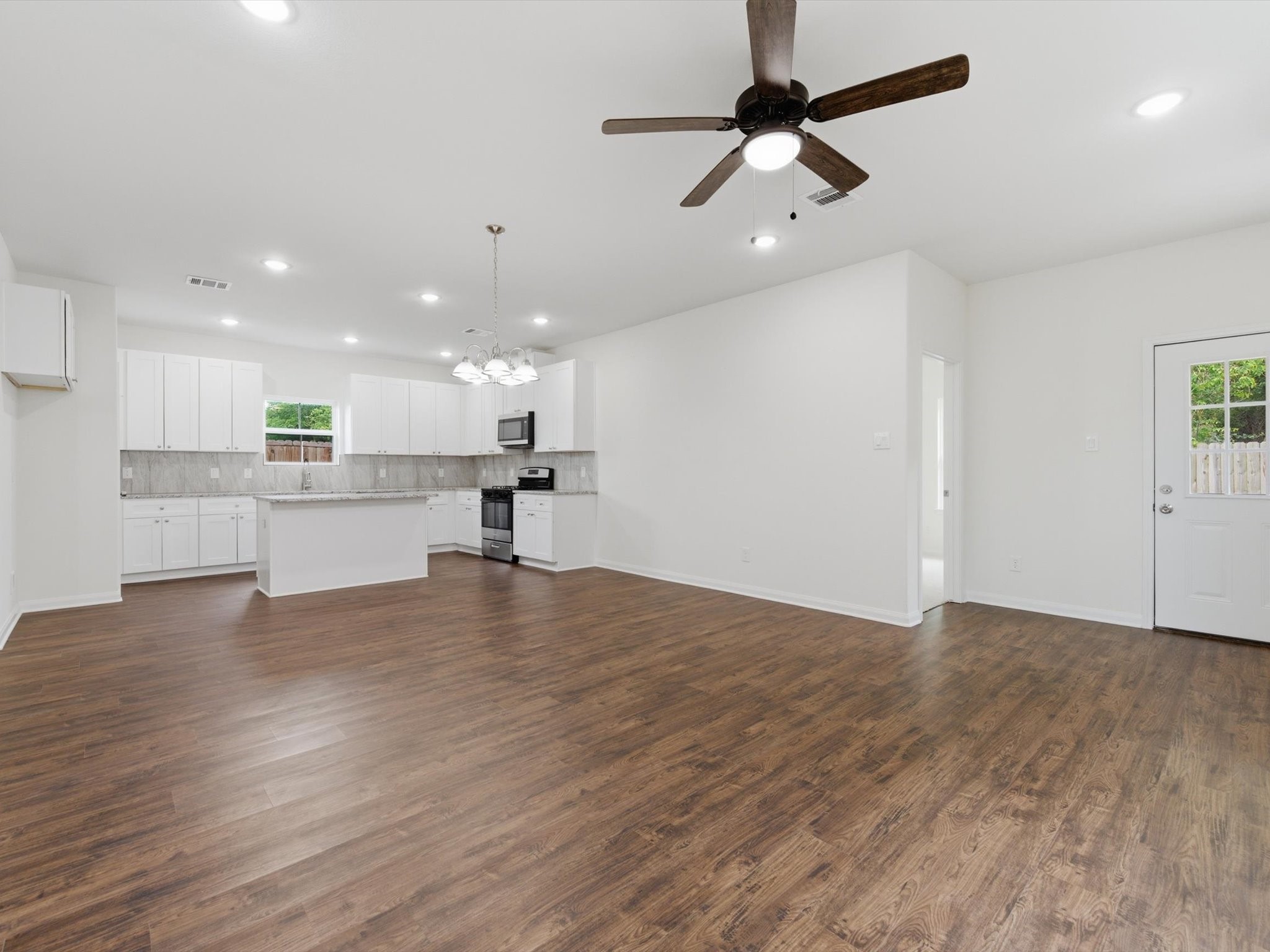 2803 Topiary Lane Houston, TX 77014 - Photo 9 of 31 The spacious living room is designed for modern living, with soaring ceilings and an open-concept layout that keeps everyone connected.