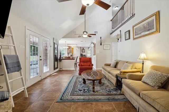 a living room with furniture and a rug