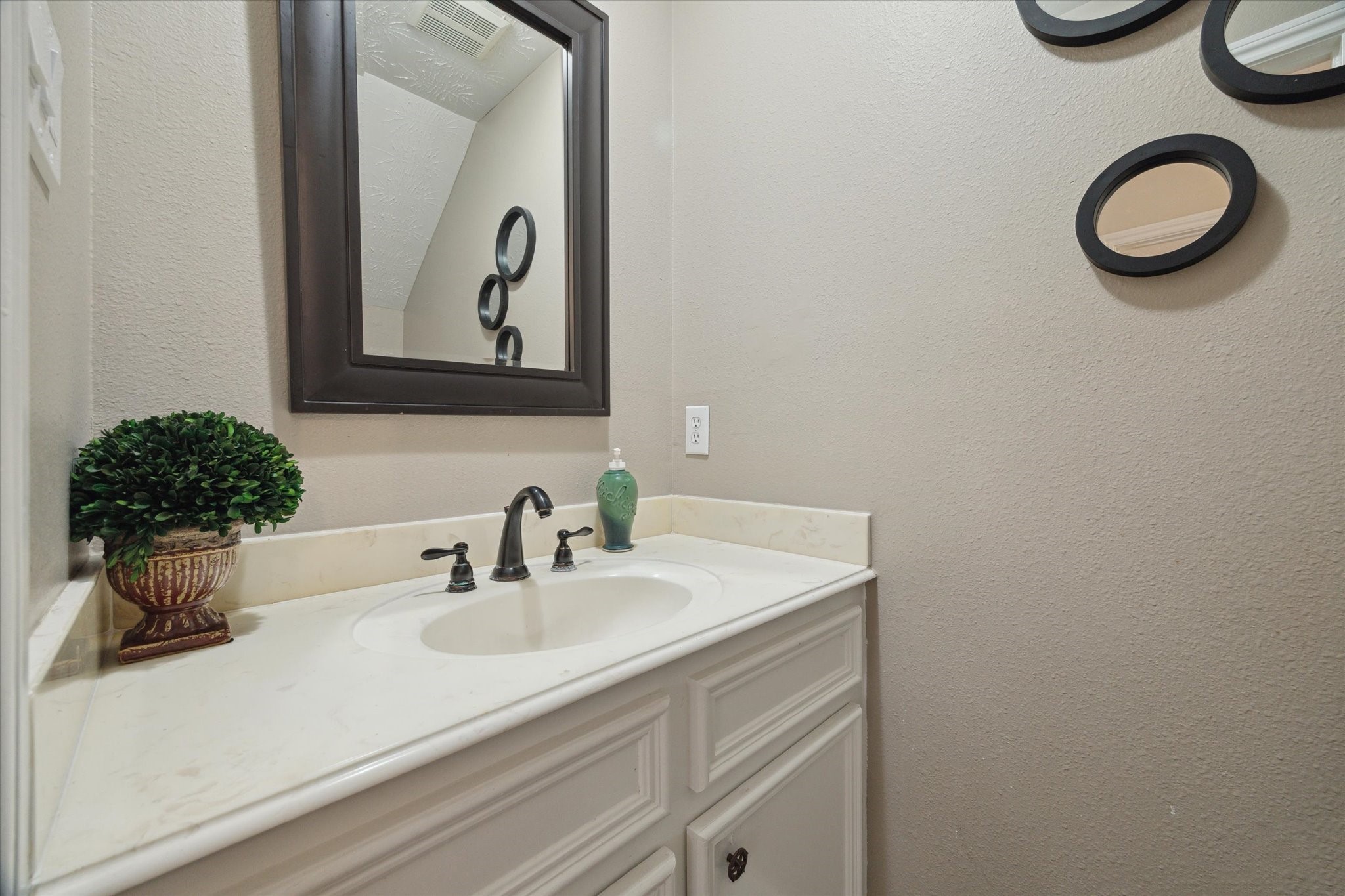 19215 Veterans Road Magnolia, TX 77355 - Photo 18 of 50 a bathroom with a sink a mirror and a toilet