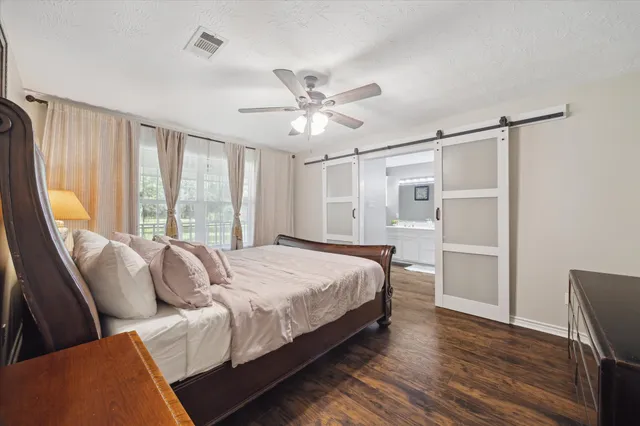 a bed room with a bed and a window