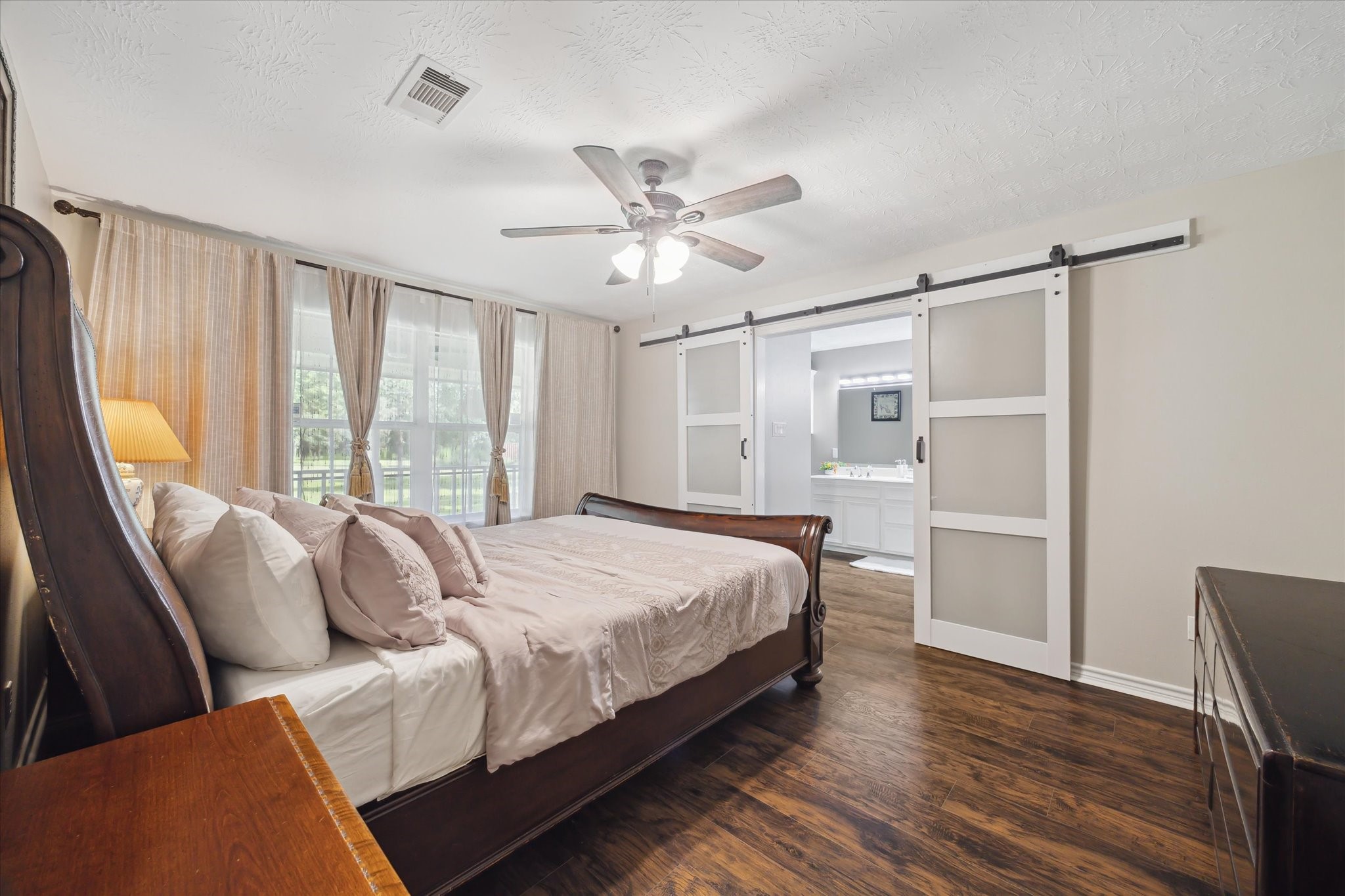 19215 Veterans Road Magnolia, TX 77355 - Photo 19 of 50 a bed room with a bed and a window