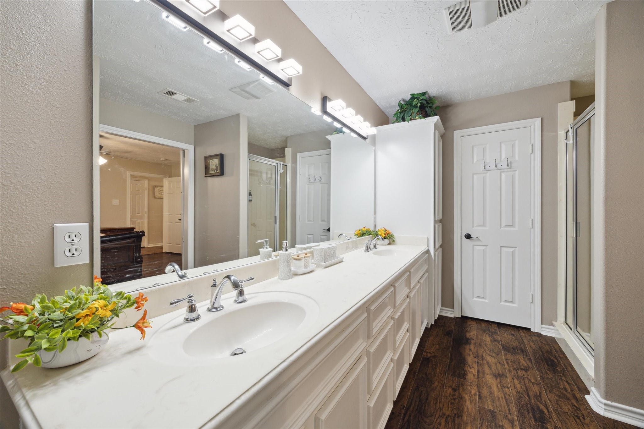 19215 Veterans Road Magnolia, TX 77355 - Photo 21 of 50 a bathroom with a double vanity sink and a mirror