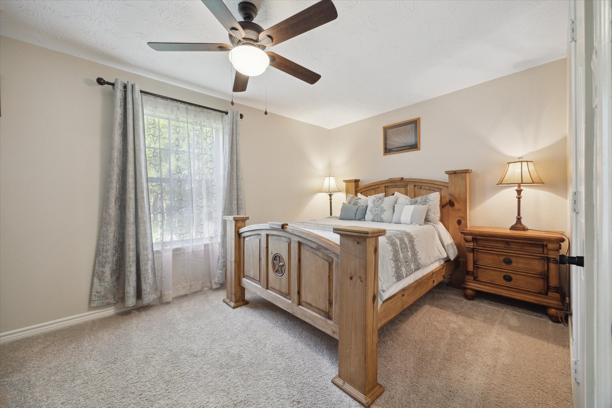 19215 Veterans Road Magnolia, TX 77355 - Photo 28 of 50 a bed room with a bed and a ceiling fan