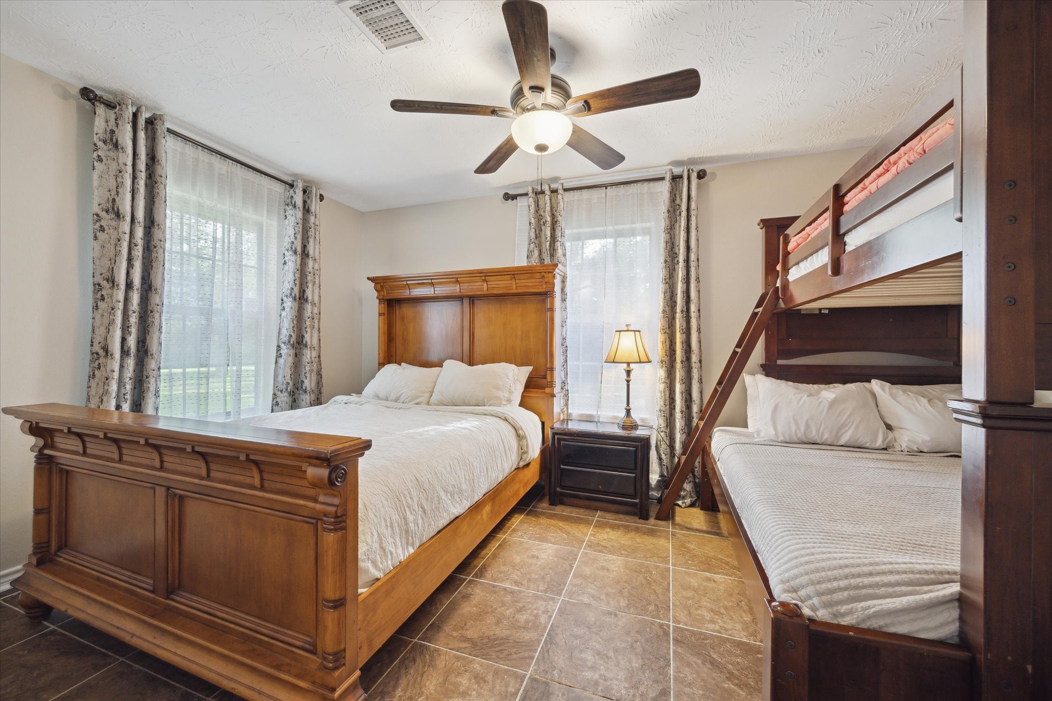 19215 Veterans Road Magnolia, TX 77355 - Photo 30 of 50 a bedroom with a bed and a window