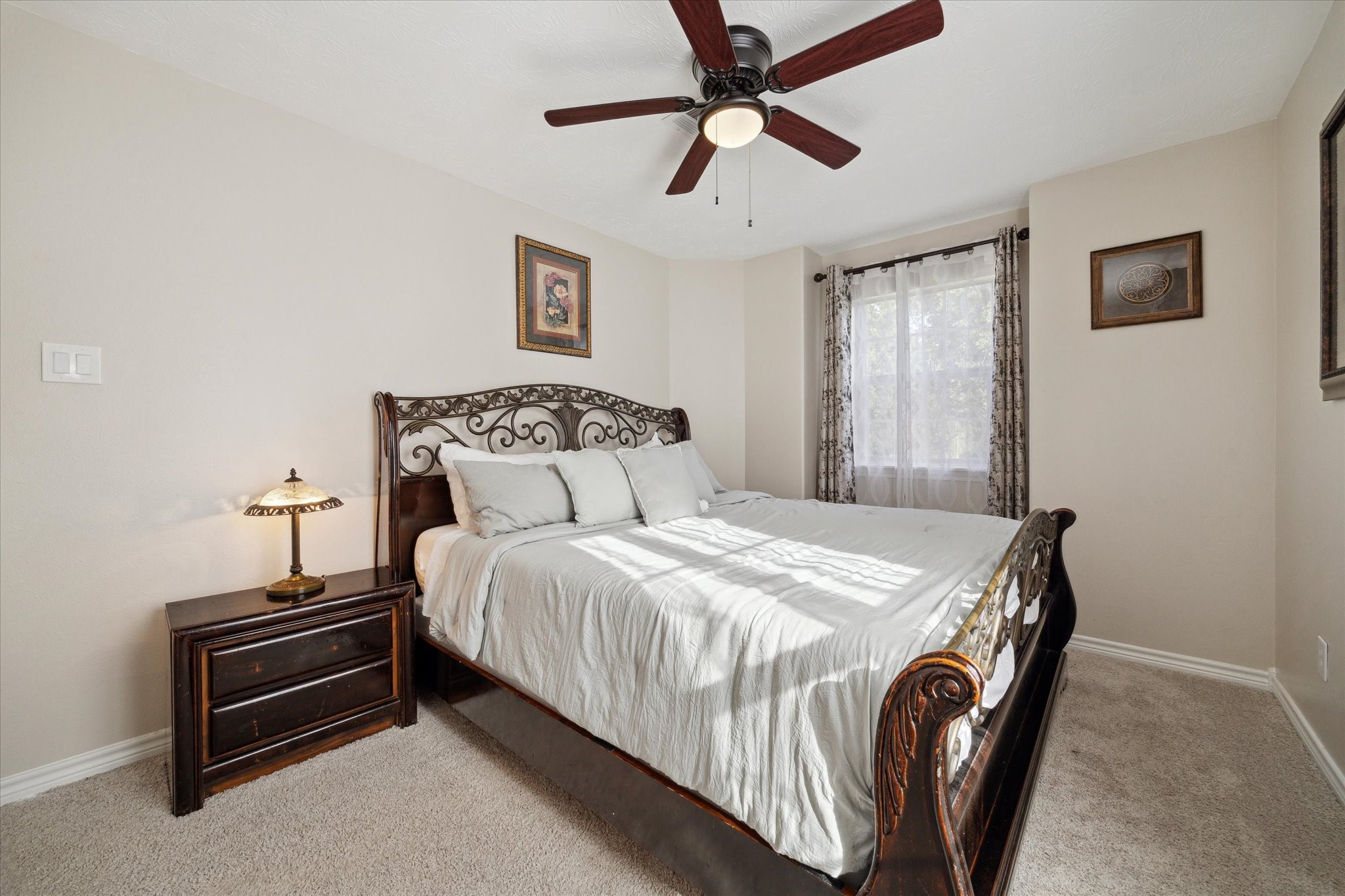 19215 Veterans Road Magnolia, TX 77355 - Photo 31 of 50 a bedroom with a bed and a chandelier