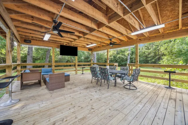 a view of a patio with table and chairs