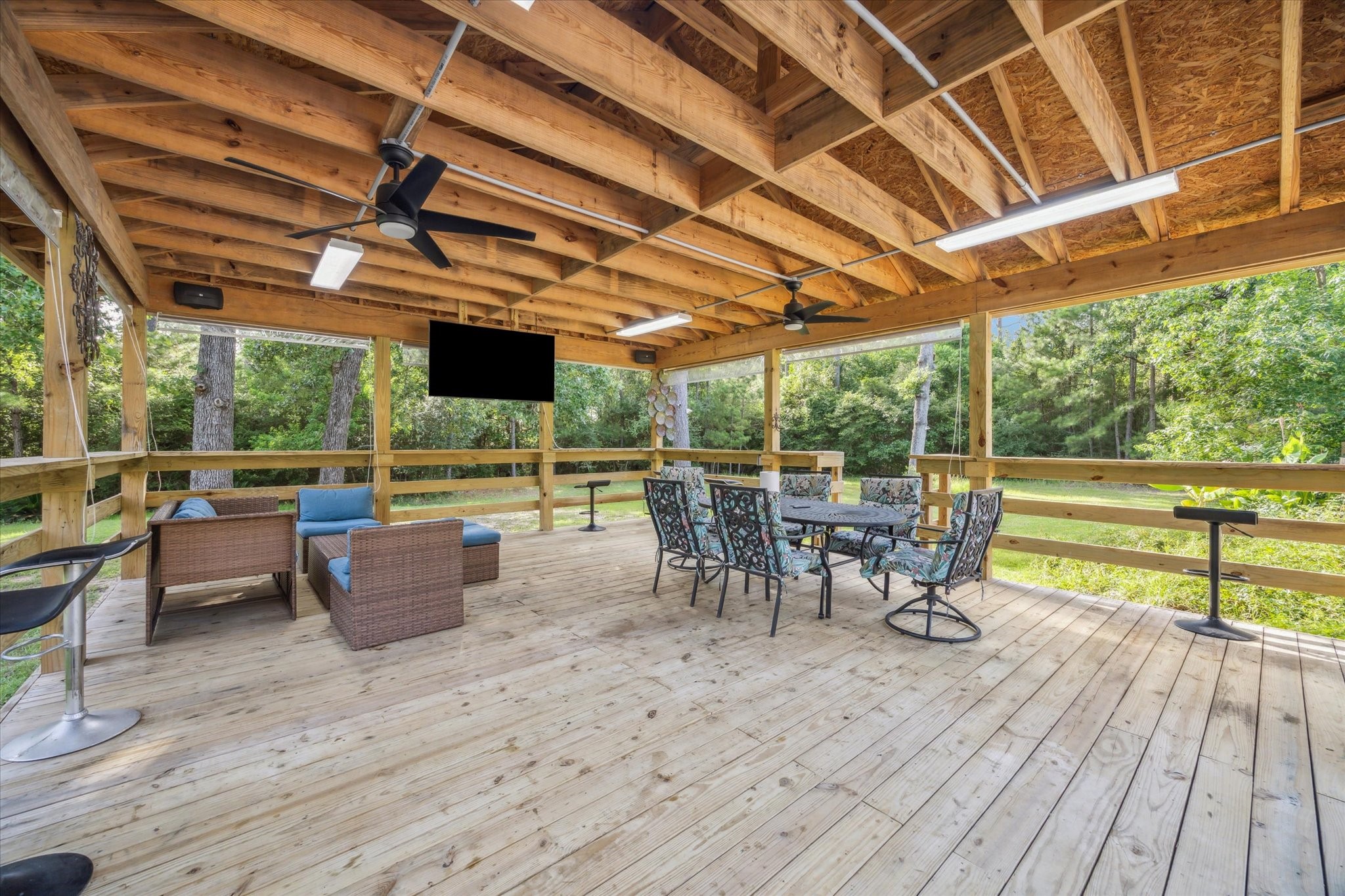 19215 Veterans Road Magnolia, TX 77355 - Photo 36 of 50 a view of a patio with table and chairs