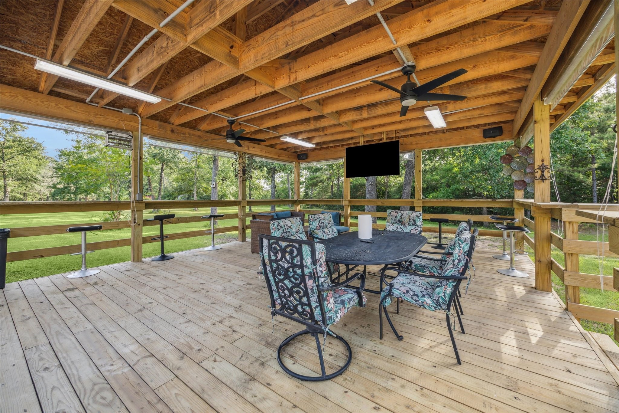 19215 Veterans Road Magnolia, TX 77355 - Photo 37 of 50 a view of a patio with table and chairs