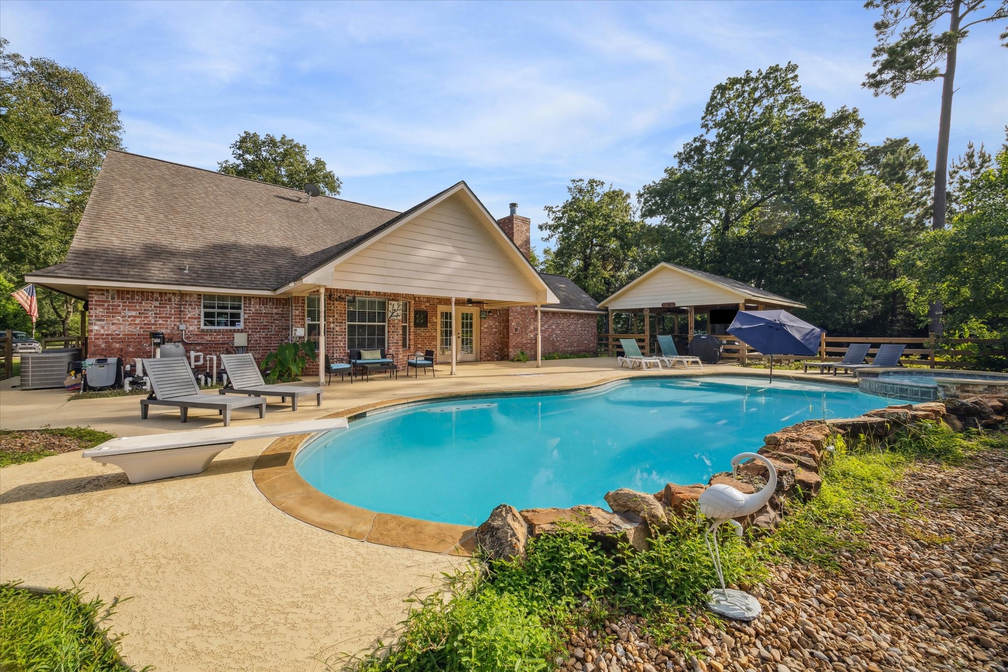 19215 Veterans Road Magnolia, TX 77355 - Photo 41 of 50 a swimming pool with outdoor seating and yard