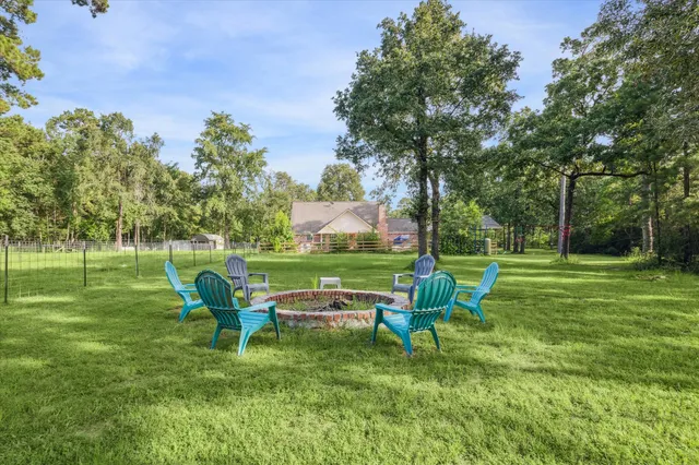 a garden with trees in the background