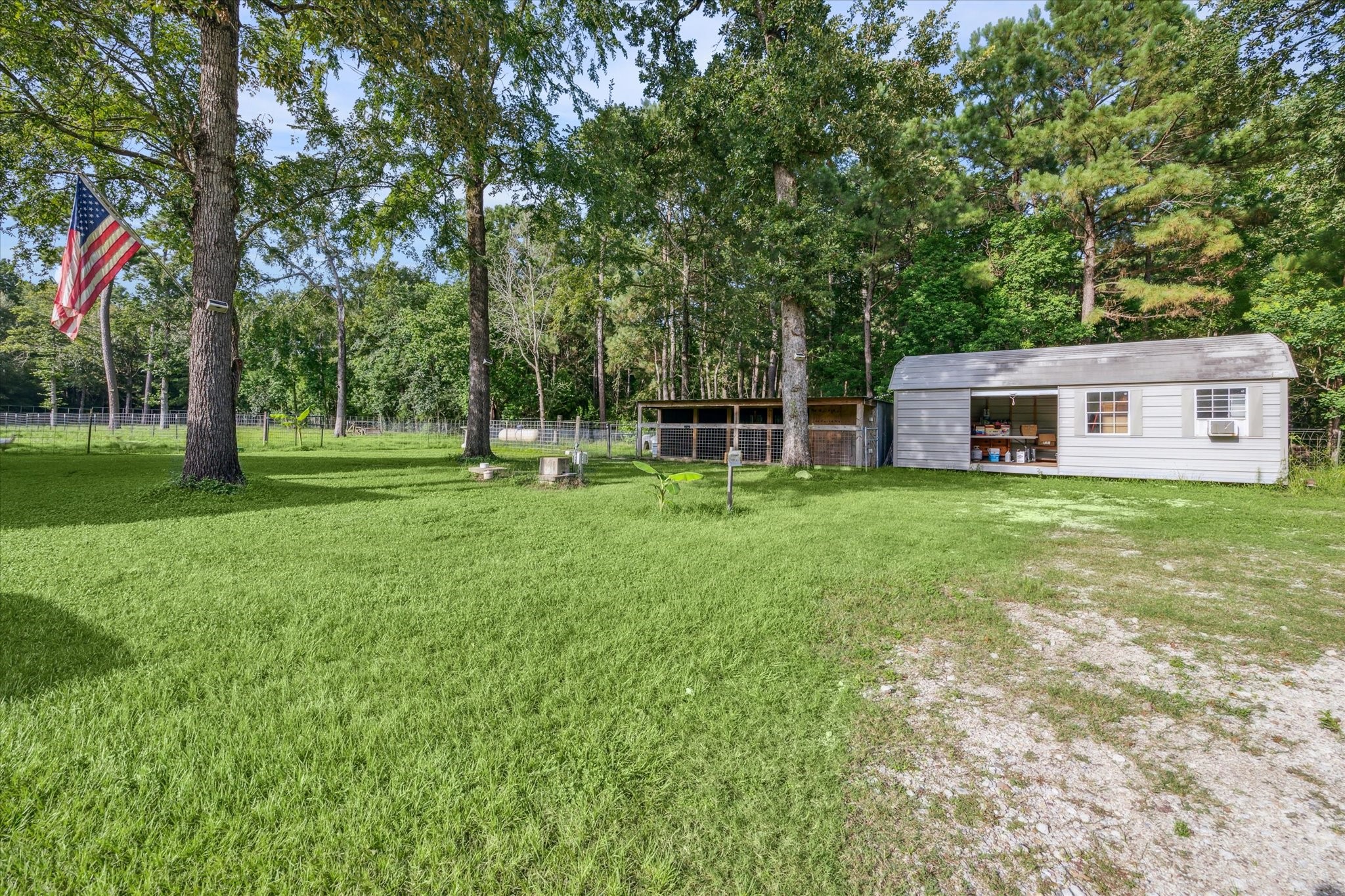 19215 Veterans Road Magnolia, TX 77355 - Photo 46 of 50 a house view with a sitting space and garden