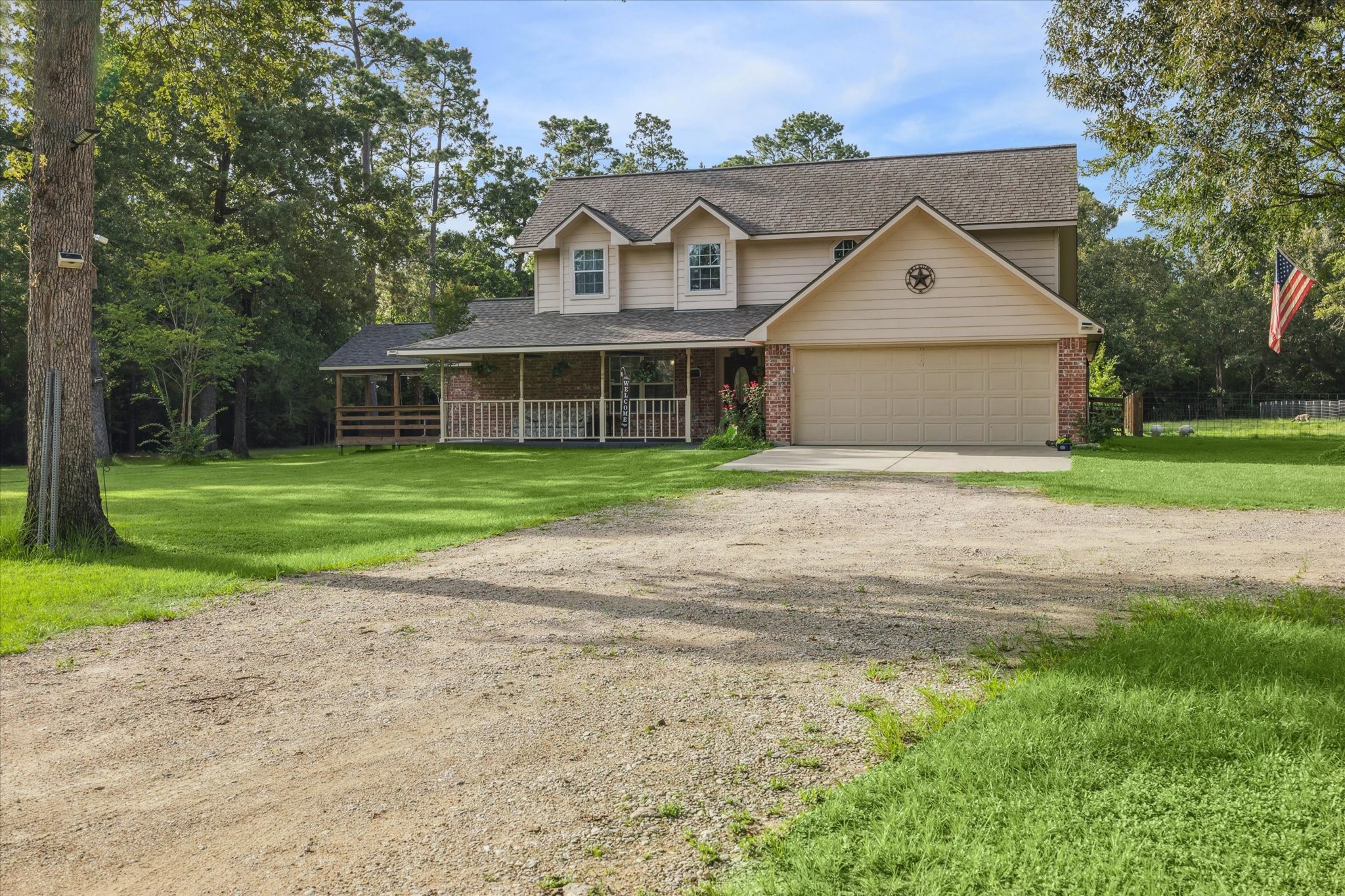 19215 Veterans Road Magnolia, TX 77355 - Photo 7 of 50 a front view of a house with yard and green space