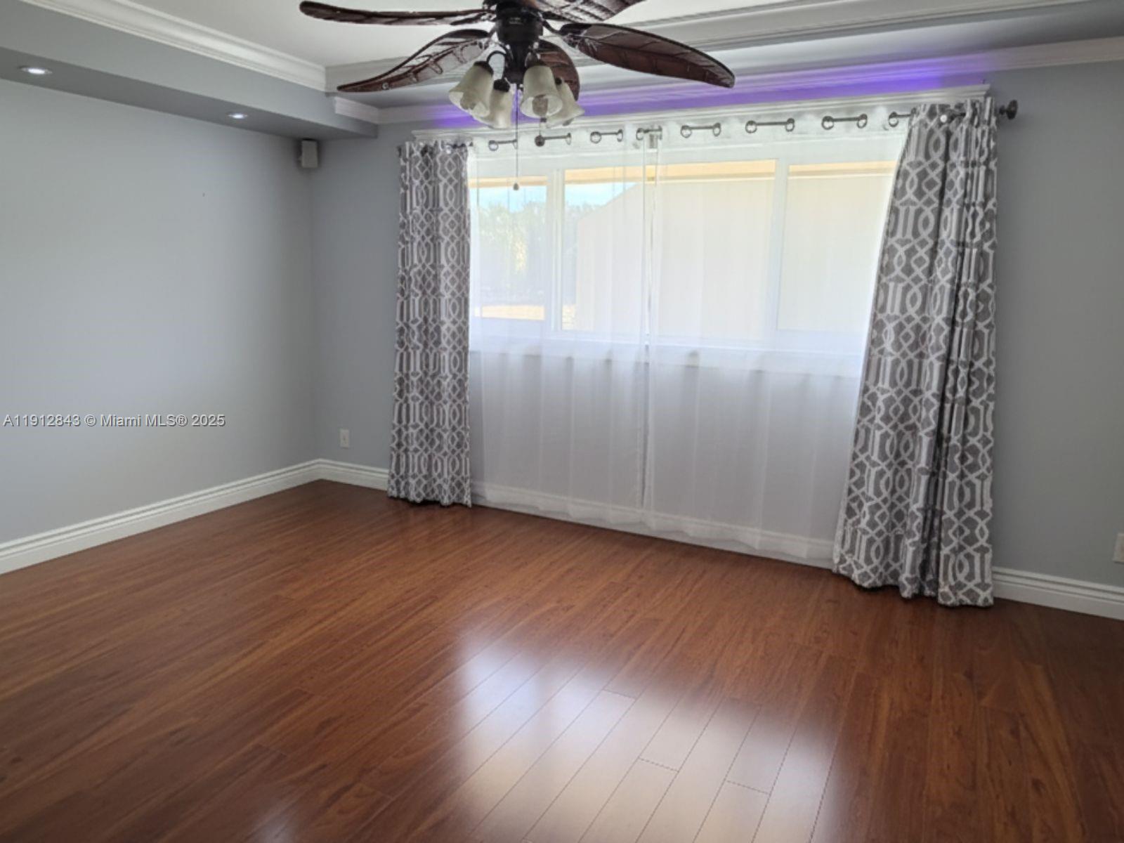 3282 North Pine Island Road, Unit 301 Sunrise, FL 33351 - Photo 11 of 25 a view of a room with wooden floor and windows