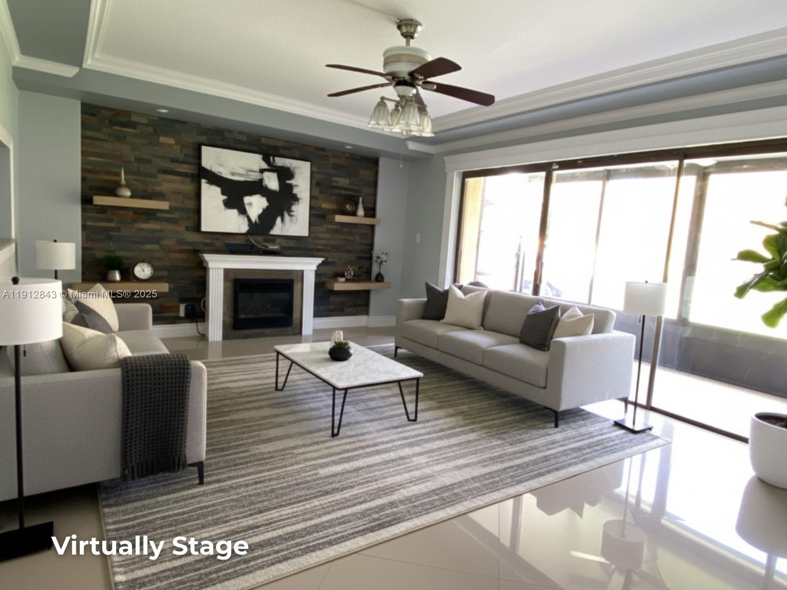 3282 North Pine Island Road, Unit 301 Sunrise, FL 33351 - Photo 8 of 25 a living room with furniture and a fireplace