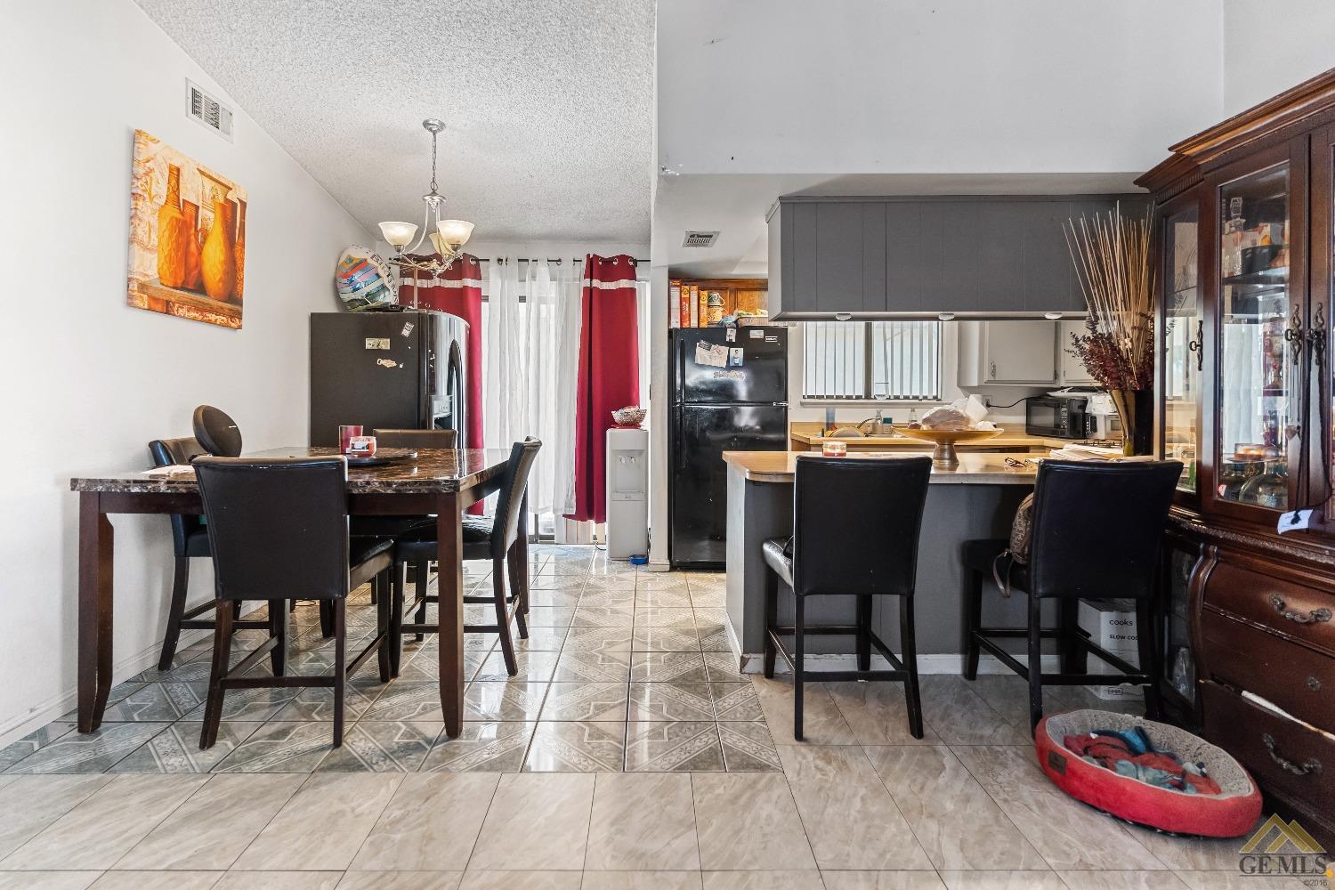 Undisclosed Address Bakersfield, CA 93304 - Photo 10 of 19 a view of a dining room with furniture