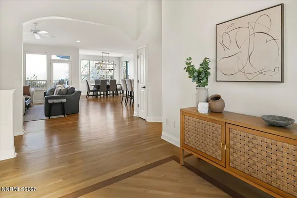 a backyard of a house with table and chairs