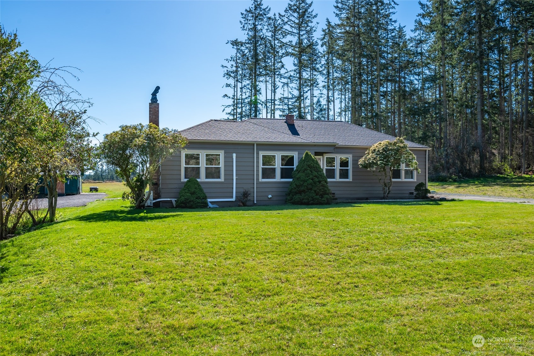 1932 Zylstra Road Oak Harbor, WA 98277 - Photo 1 of 40 a front view of a house with a garden