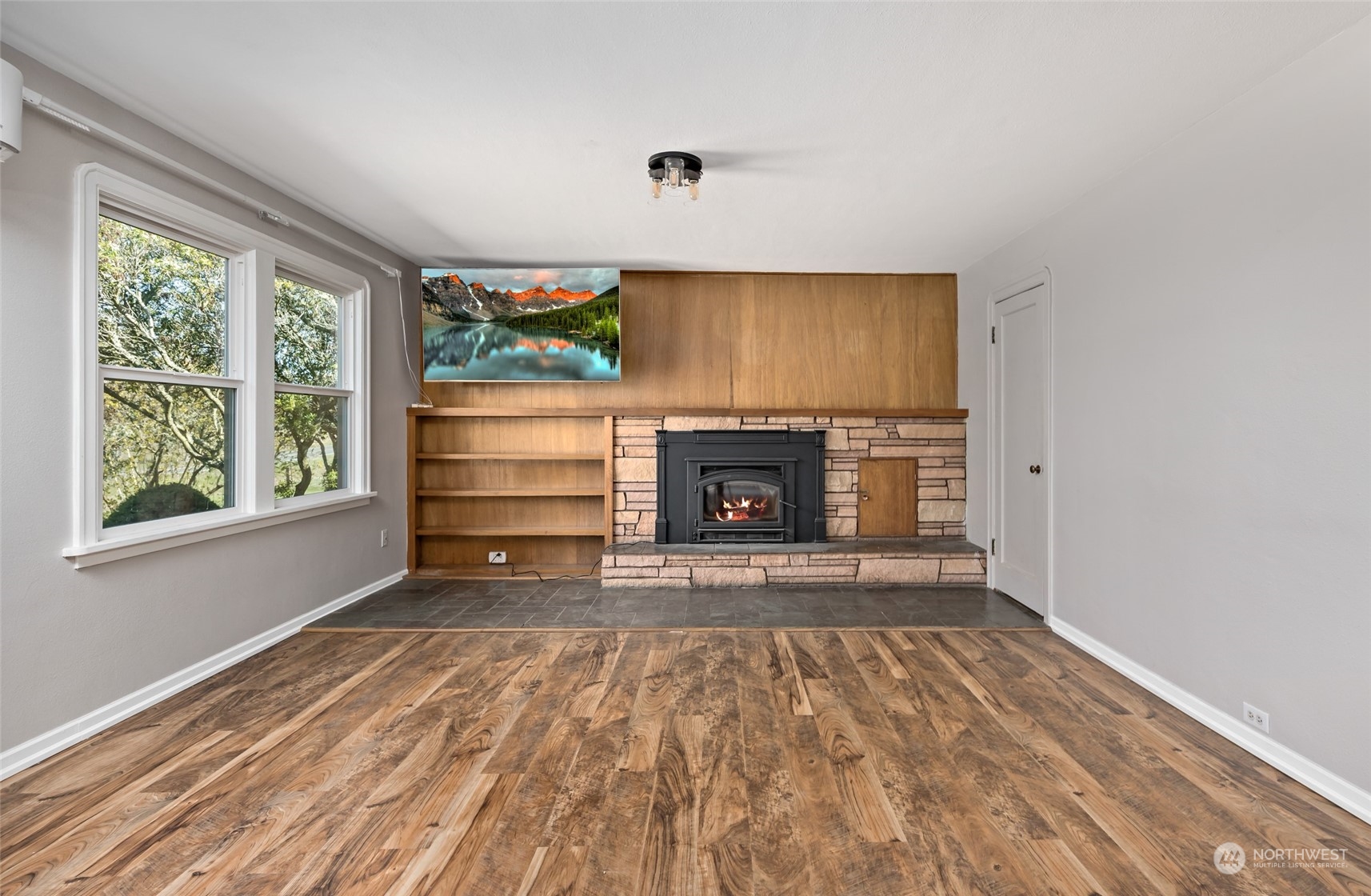 1932 Zylstra Road Oak Harbor, WA 98277 - Photo 11 of 40 a view of empty room with a fireplace and window
