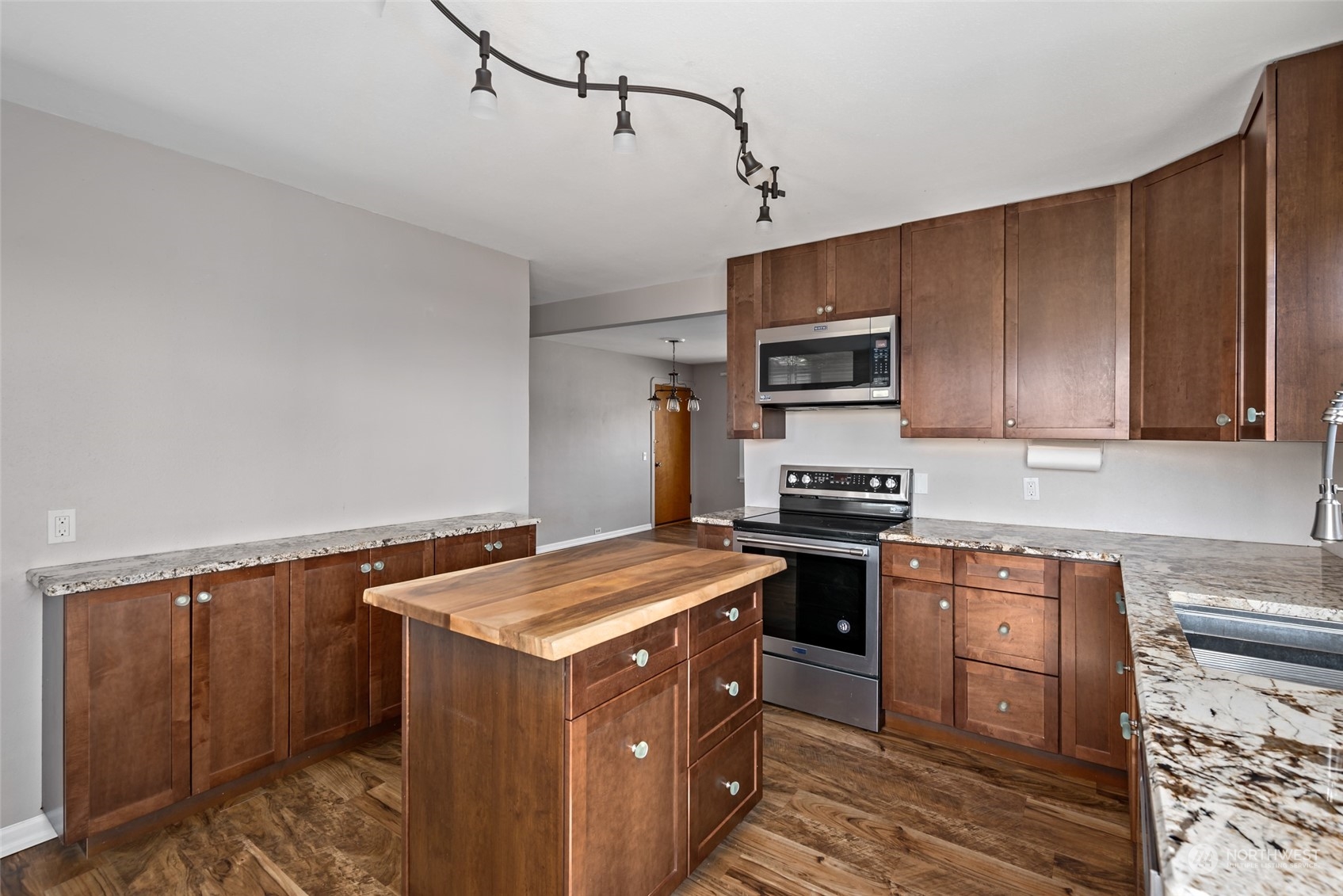 1932 Zylstra Road Oak Harbor, WA 98277 - Photo 14 of 40 a kitchen with stainless steel appliances granite countertop a stove a sink and a refrigerator