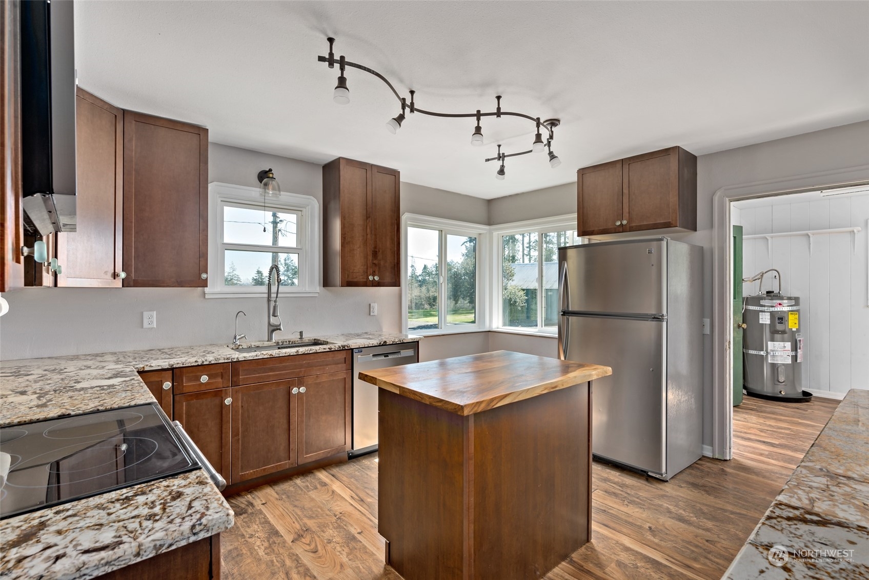 1932 Zylstra Road Oak Harbor, WA 98277 - Photo 15 of 40 a kitchen with stainless steel appliances granite countertop a refrigerator a sink a stove and a refrigerator