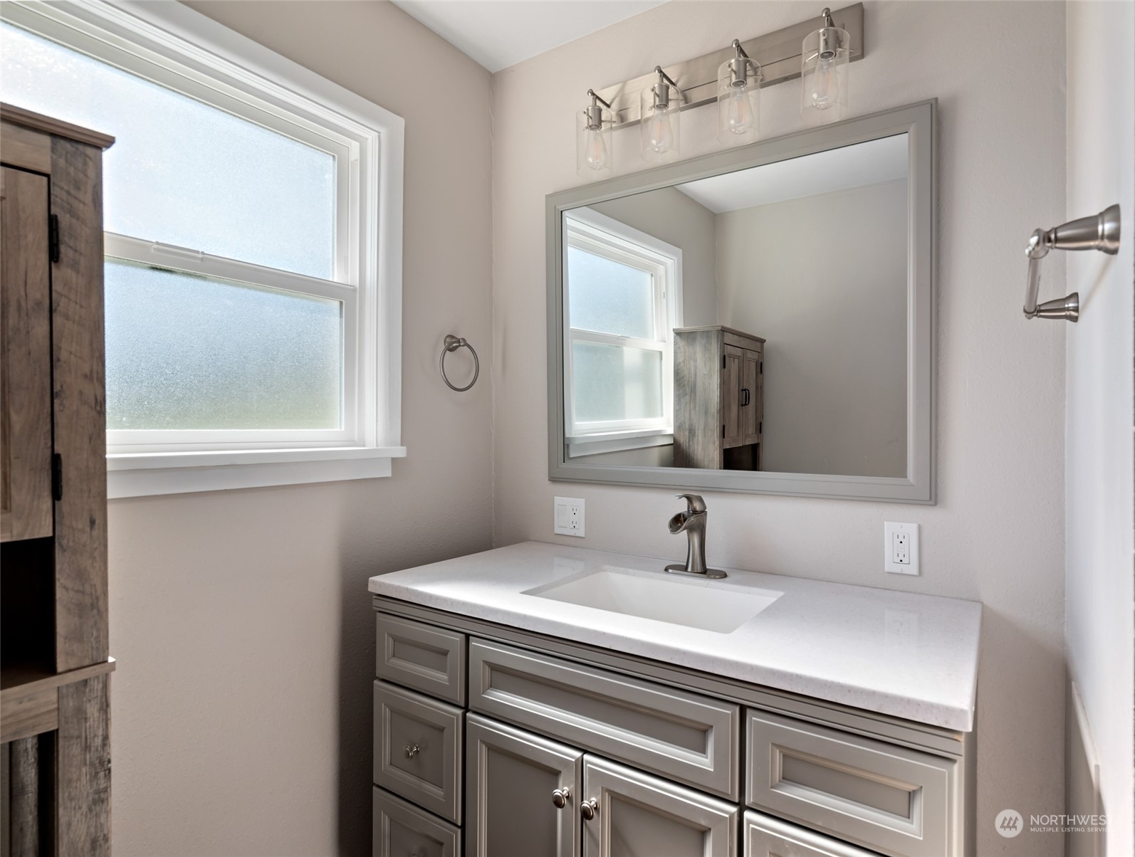 1932 Zylstra Road Oak Harbor, WA 98277 - Photo 19 of 40 a bathroom with a sink and a mirror