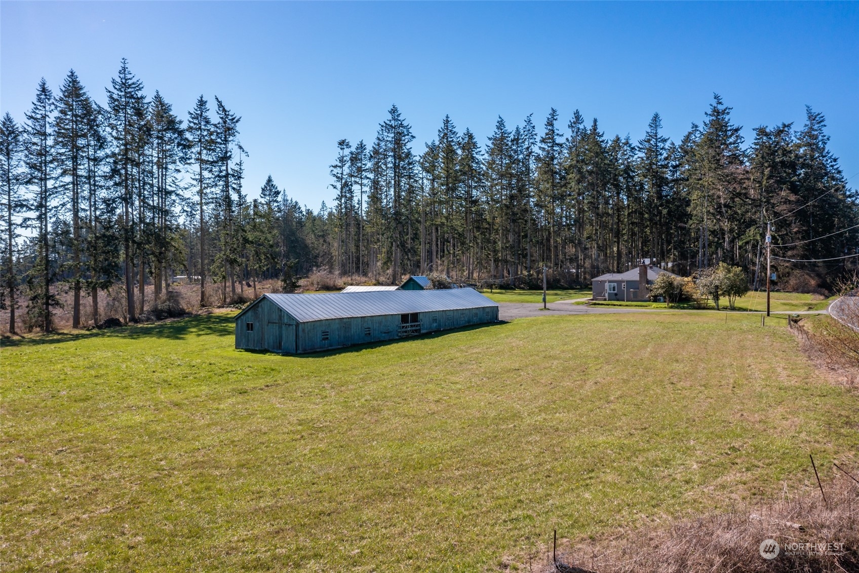 1932 Zylstra Road Oak Harbor, WA 98277 - Photo 26 of 40 a backyard of a house with a yard and outdoor seating