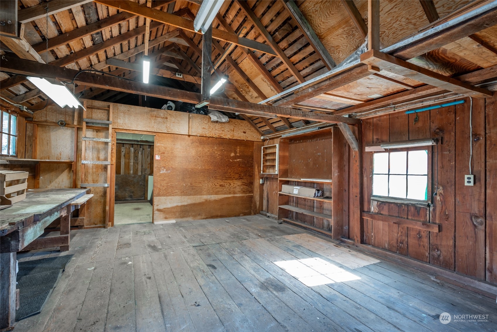 1932 Zylstra Road Oak Harbor, WA 98277 - Photo 31 of 40 a view of an empty room with wooden floor and a window
