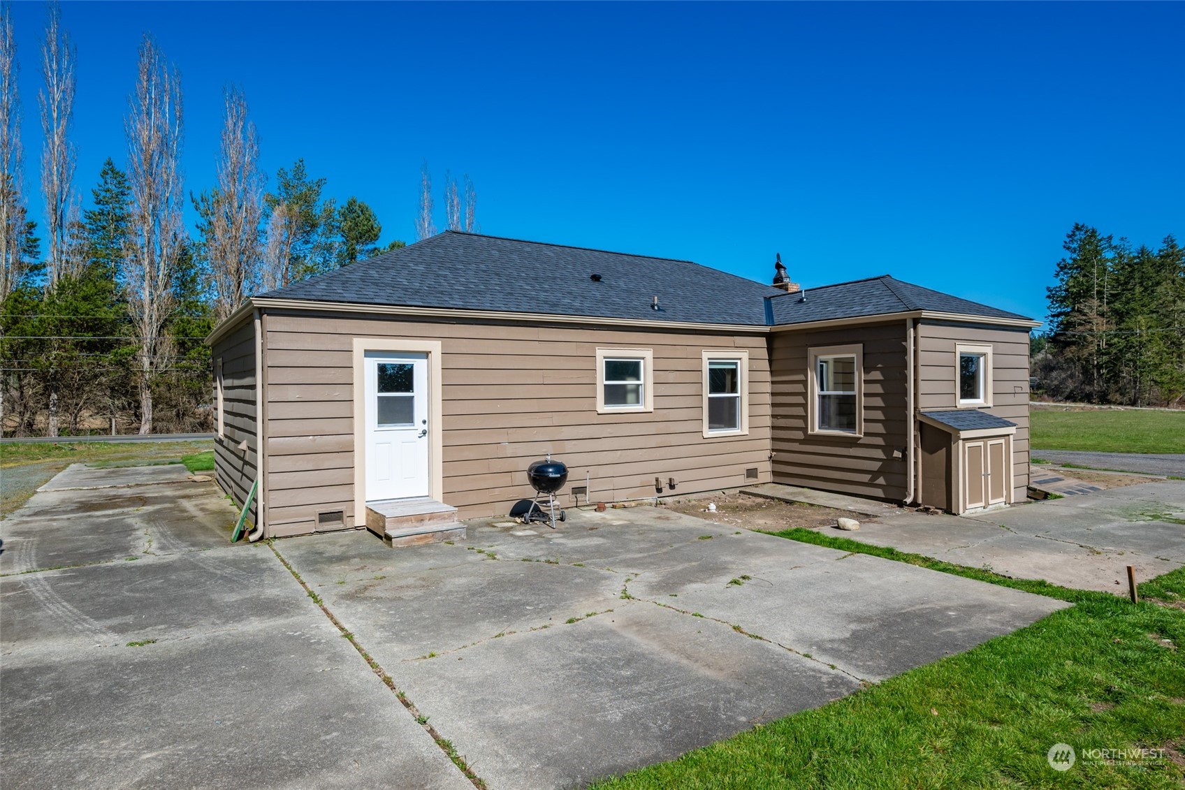 1932 Zylstra Road Oak Harbor, WA 98277 - Photo 4 of 40 a view of a house with backyard and sitting area